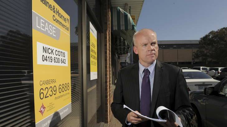 Chamber of Commerce chief executive officer Andrew Blyth outside a building for lease in Phillip. Photo: Graham Tidy