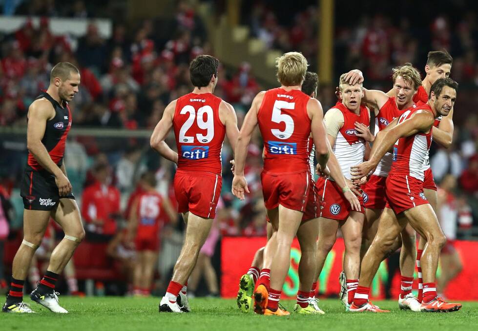 Big comeback: Dan Hannebery of the Swans celebrates a goal. Photo: Getty Images