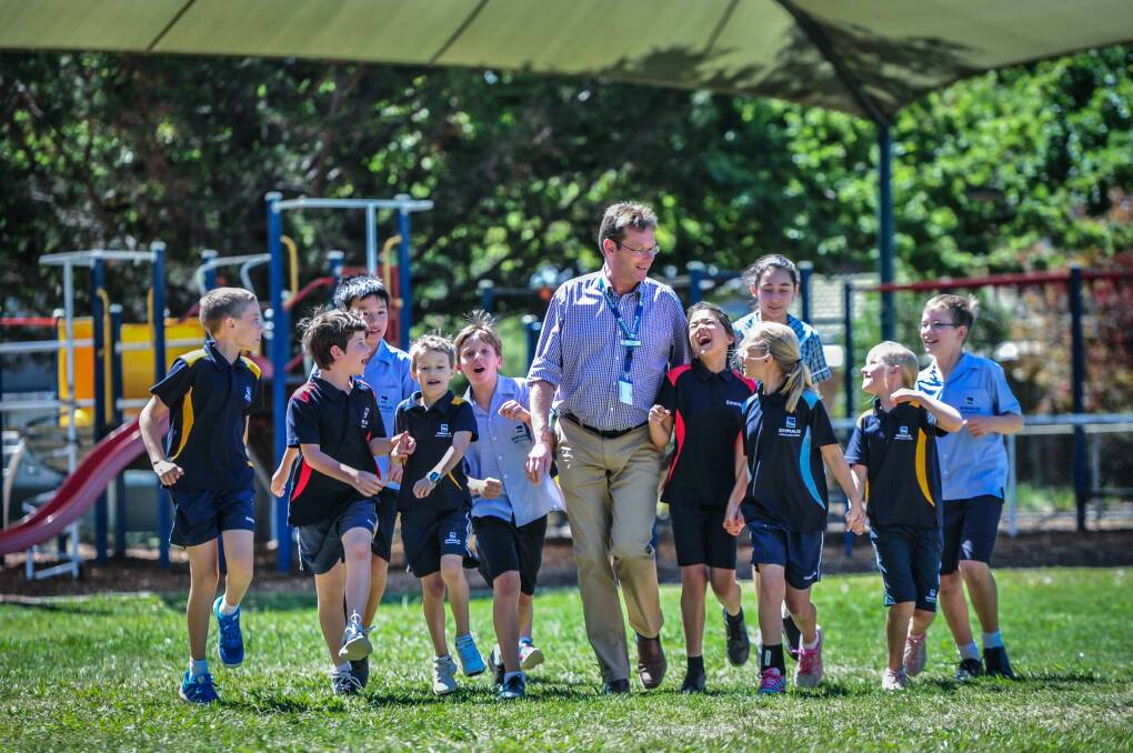 Emmaus School Principal Erik Hofsink and students have enjoyed great Naplan results this year. "We're a really happy little school in leafy old Dickson." Photo: karleen minney