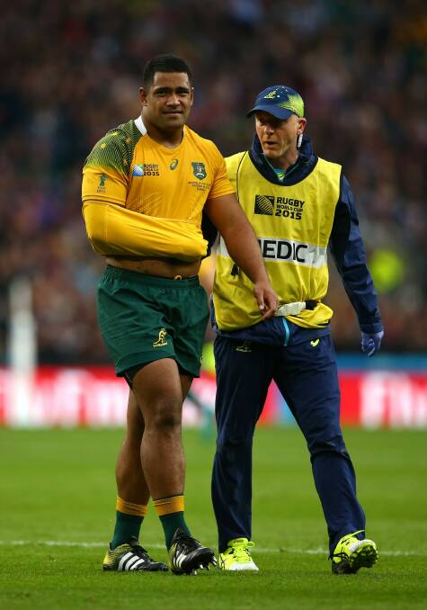 Painful: Scott Sio leaves the field against Scotland at Twickenham. Photo: Getty Images