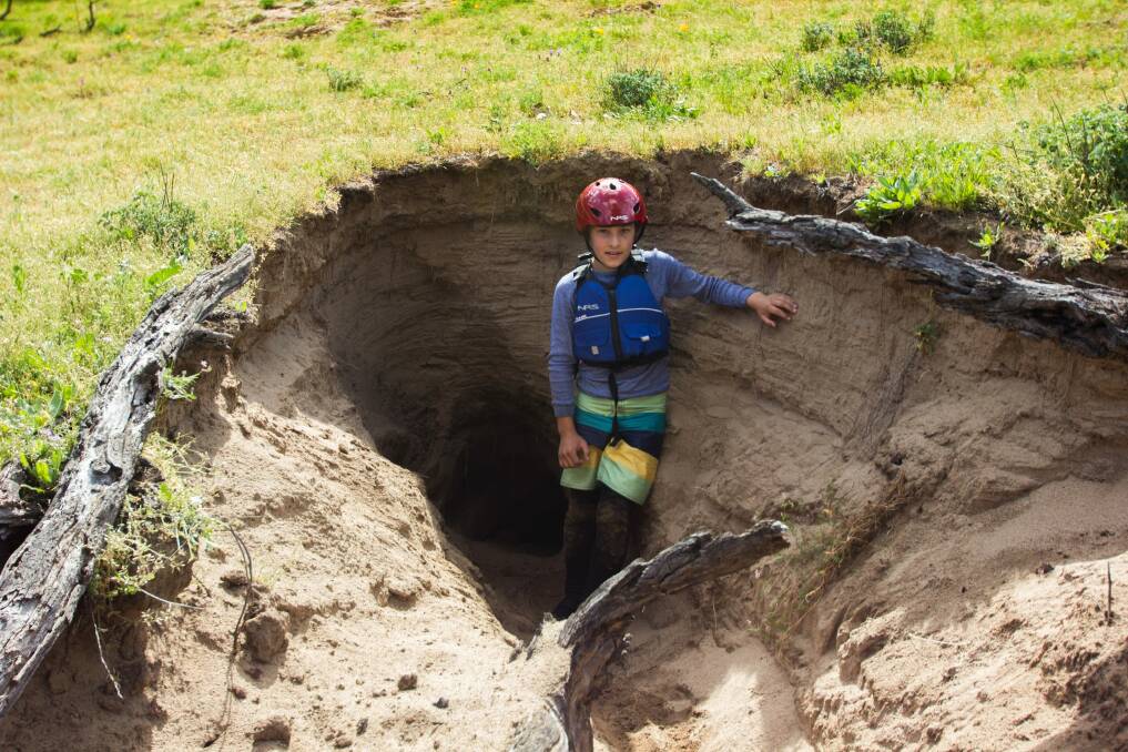 Check out this giant wombat burrow on the Snowy. Bear Grylls would crawl in there, would you? Photo: Shane Pennicuik