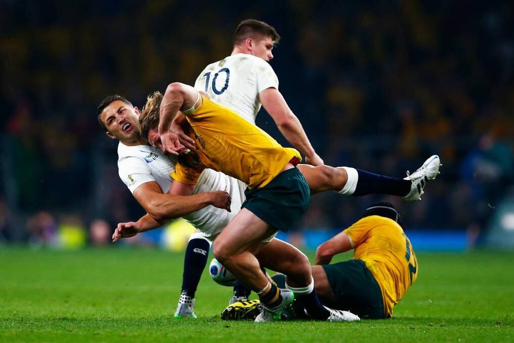 Sam Burgess catches Michael Hooper in the World Cup pool game. Photo: Getty Images
