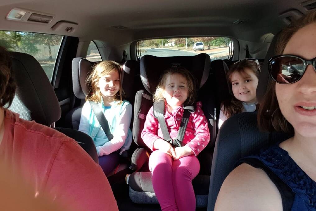 Banks family Lachlan Wilson (obscured) and Cassandra Weller and their daughters, Paityn, Millicent and Annabelle,  on their way to Sydney, before the crash