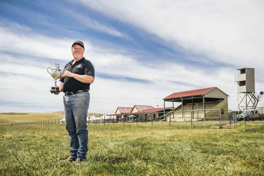 Lynley Miners with a 1926 trophy at Adaminaby racecourse, ahead of the 150th anniversary of racing in the mountain village on Saturday. Photo: Rohan Thomson