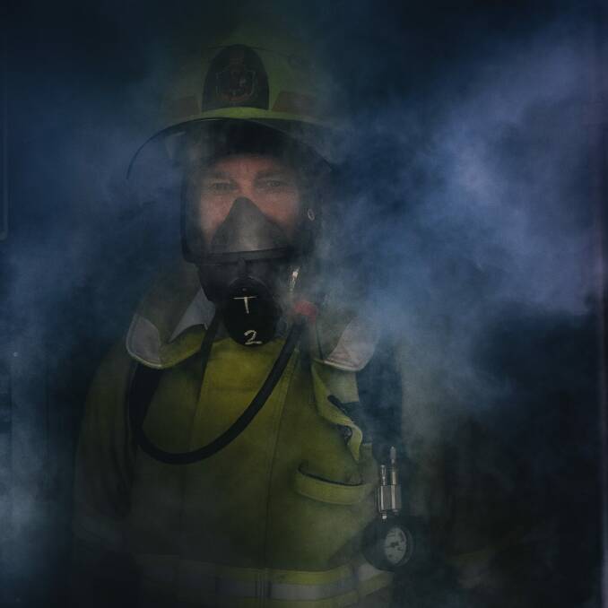 Senior Firefighter Brett Musial in the doorway of the hot/smoke house at the ACT Fire and Rescue training centre in Hume.  Photo: Rohan Thomson
