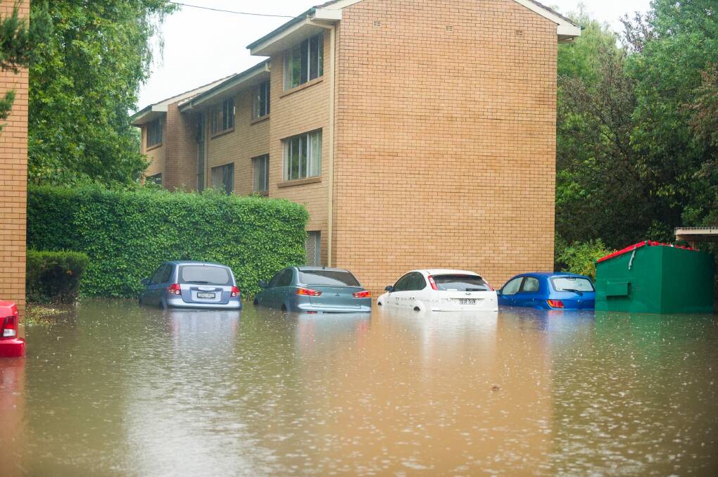 Flooding at an apartment block in O'Connor. Photo: Dion Georgopoulos