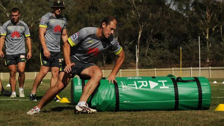 Raiders captain Terry Campese steps around the tackle bags at training. Photo: Colleen Petch