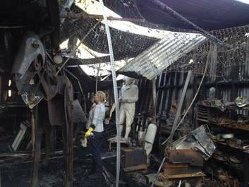 Braidwood artist Suzie Bleach in the burnt-out study used by her and her partner Andy Townsend. Photo: Nick Stranks