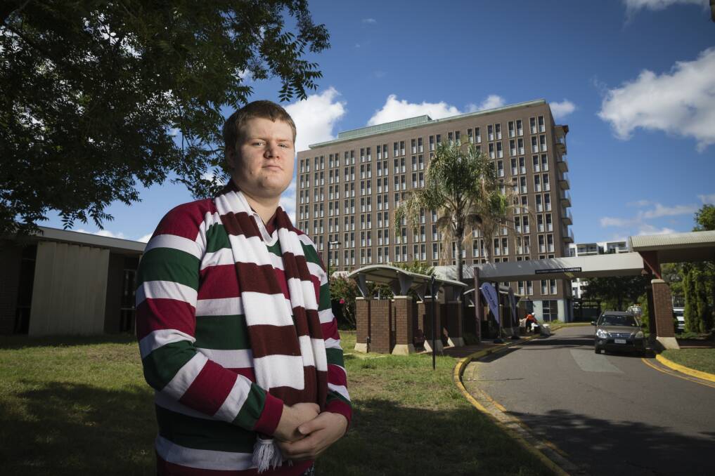Like most Australian National University students, David Harvey (pictured) expected the former Fenner Hall building on Northbourne Avenue (background) to be demolished or sold. Photo: Sitthixay Ditthavong