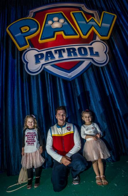 Junior theatre reviewer April Thurling (left) with cousin Darcy Winchester meeting star of Paw Patrol Live, Ryder. Photo: Karleen Minney