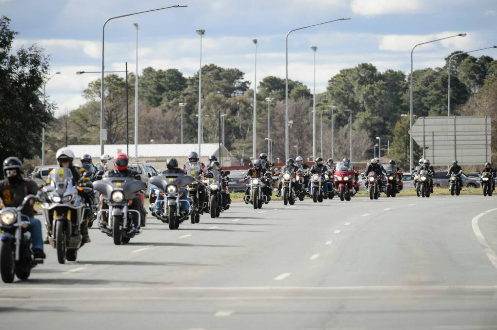 A long convoy of motorbikes makes its way down Northbourne Avenue during the 2017 Wall to Wall Ride for Remembrance. Photo: Sitthixay Ditthavong
