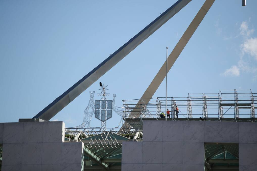 Workers with scaffolding on the roof of Parliament House. Photo: Fairfax Media