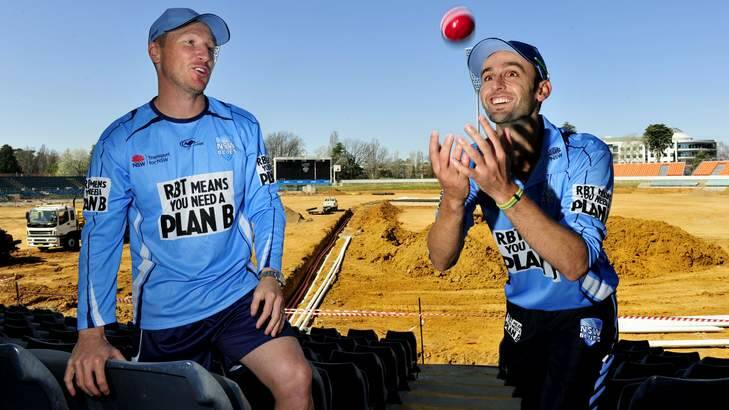 Australian cricketers Brad Haddin and Nathan Lyon at Manuka Oval, Canberra. Both players have set their sights on an Ashes series win this summer. Photo: Melissa Adams
