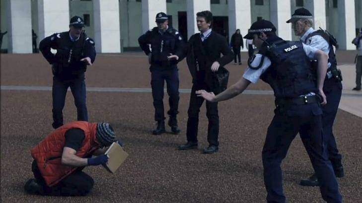 Police guarding Parliament House confront brothers played by Ashley Zukerman and Dan Spielman in the ABC political drama <i>The Code</i>, which was shot in Canberra.  Photo: ABC