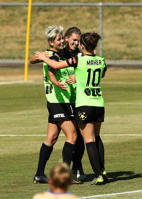 Michelle Heyman celebrates with teammates after scoring a goal during the round four W-League match between Canberra United and the Newcastle Jets at McKellar Park. Photo: Getty Images