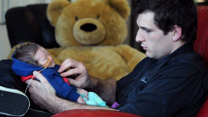 Four-week-old Victoria Branson-Zucchetto and dad Todd Zucchetto at Ronald McDonald house. Photo: Graham Tidy