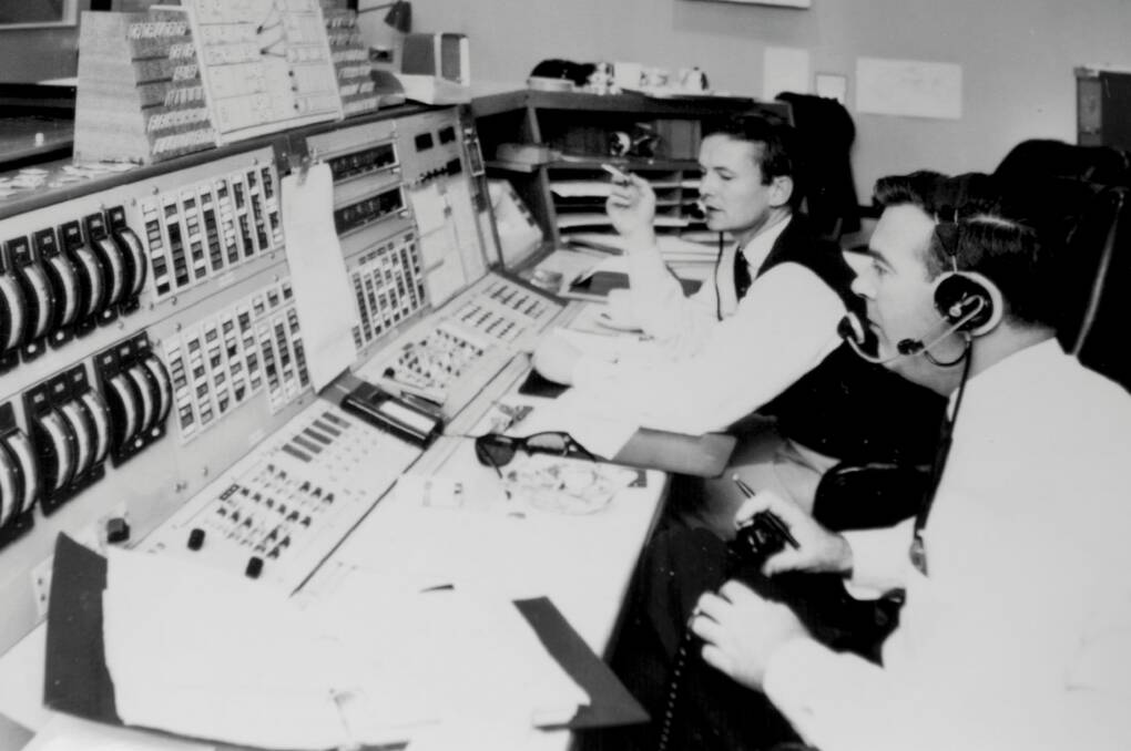 John Saxon, left, at the controls with a cigarette in hand.   Photo: Jay Cronan