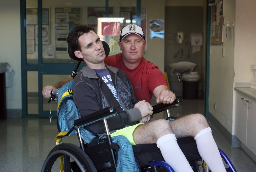 Matt Pridham with his father David in the Brains Injury Unit at Liverpool Hospital in Sydney in 2013. Photo: Fiona Morris
