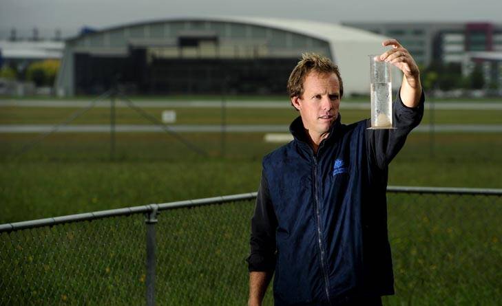 Watching the weather ... senior meteorologist Sean Carson checks rainfall at Canberra Airport. Photo: Stuart Walmsley