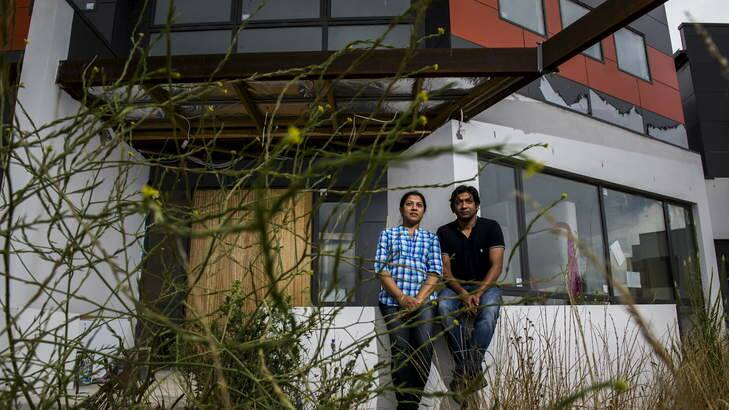 Kazi Nahar and Asik Hossain outside their unfinished  home in Franklin. Photo: Rohan Thomson