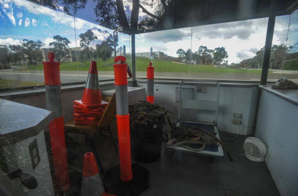 One of the unused guardhouses is used  to store traffic markers... and a heater. Photo: Graham Tidy