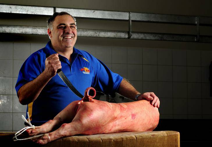 Gino D'Ambrosio, owner of Eco Meats in Belconnen Market, uses only salt to cure the bacon he sells in his store. Photo: Stuart Walmsley