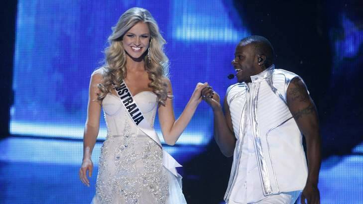 Miss Australia Renae Ayris is escorted by Australian singer/songwriter and dancer Timomatic during the Miss Universe pageant last year. Photo: Reuters