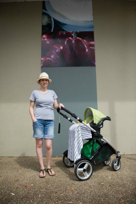 News
Emma Paton, with her six-week-old son Wyatt, says one of the things she likes about Supabarn is that it doesn't have self-serve counters so preserves more jobs. Photo: Jay Cronan