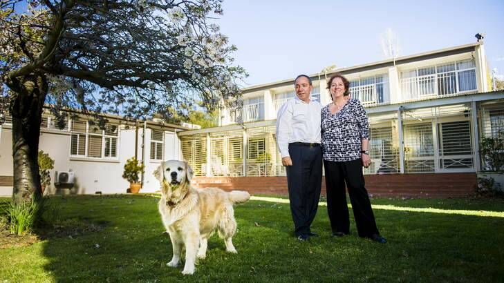 Departing Israeli ambassador Yuval Rotem and his wife Miri and pet dog Bailey at the embassy in Yarralumla. Photo: Rohan Thomson