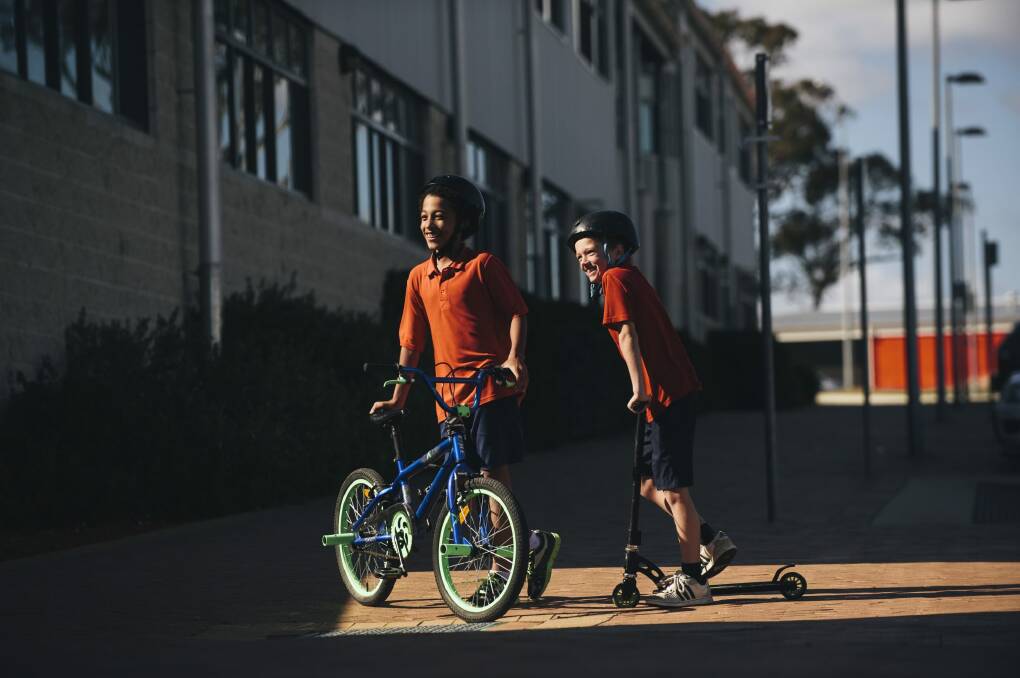 Amaroo primary year 4 students Parris Bangweni and Zayne Tennent at the school for an announcement of funding to expand active travel options for ACT students.  Photo: Rohan Thomson