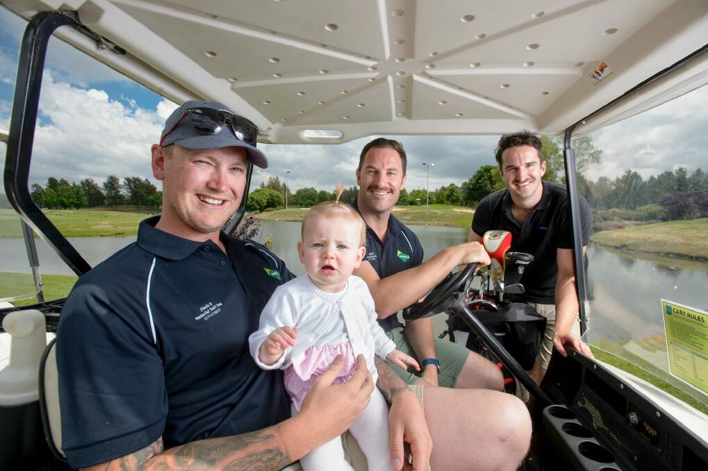 Zach Douglas, ten-month-old Audrey Douglas, celebrity Movember ambassador Sasha Mielczarek, and Movember campaign manager Ben O'Connell at the Stevie D Memorial Golf Day in Canberra on Friday. Photo: Sitthixay Ditthavong
