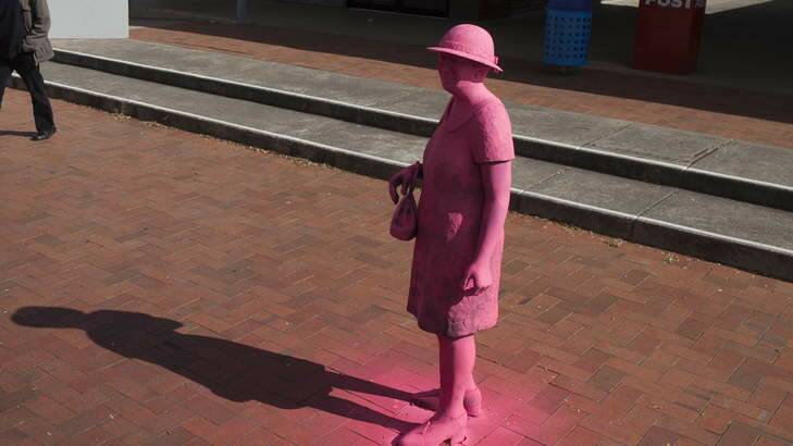 The Stepping Out (Lady in Pearls) sculpture at Hughes shops is sometimes spray-painted a bright pink.
