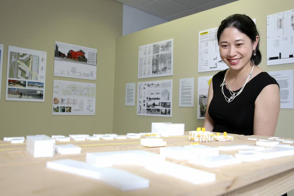 Gallery of Australian Design director Adelin Chin looking over a design for light rail on Northbourne Avenue. Photo: Jeffrey Chan