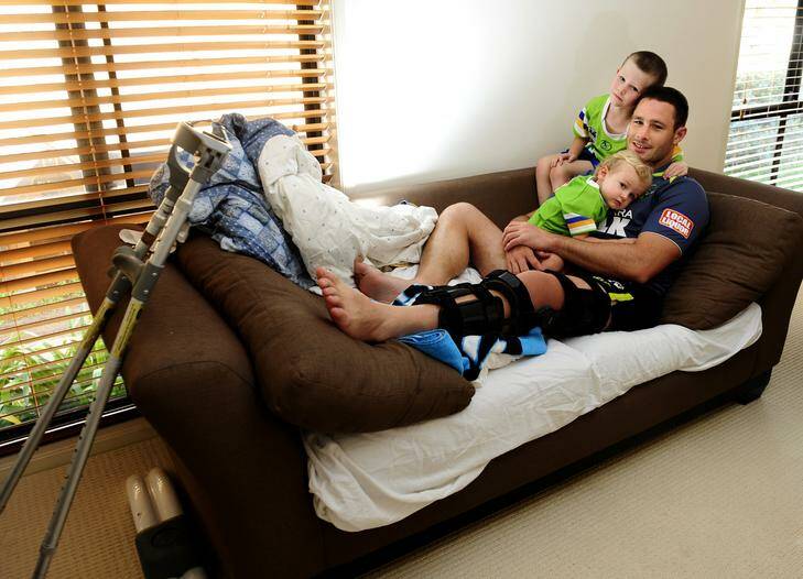 Raiders vice-captain Brett White relaxes at home with sons, Jack, 5, and Colt, 19 months, yesterday. Raiders vice-captain White is keeping a positive attitude despite his season-ending injury. Photo: Melissa Adams