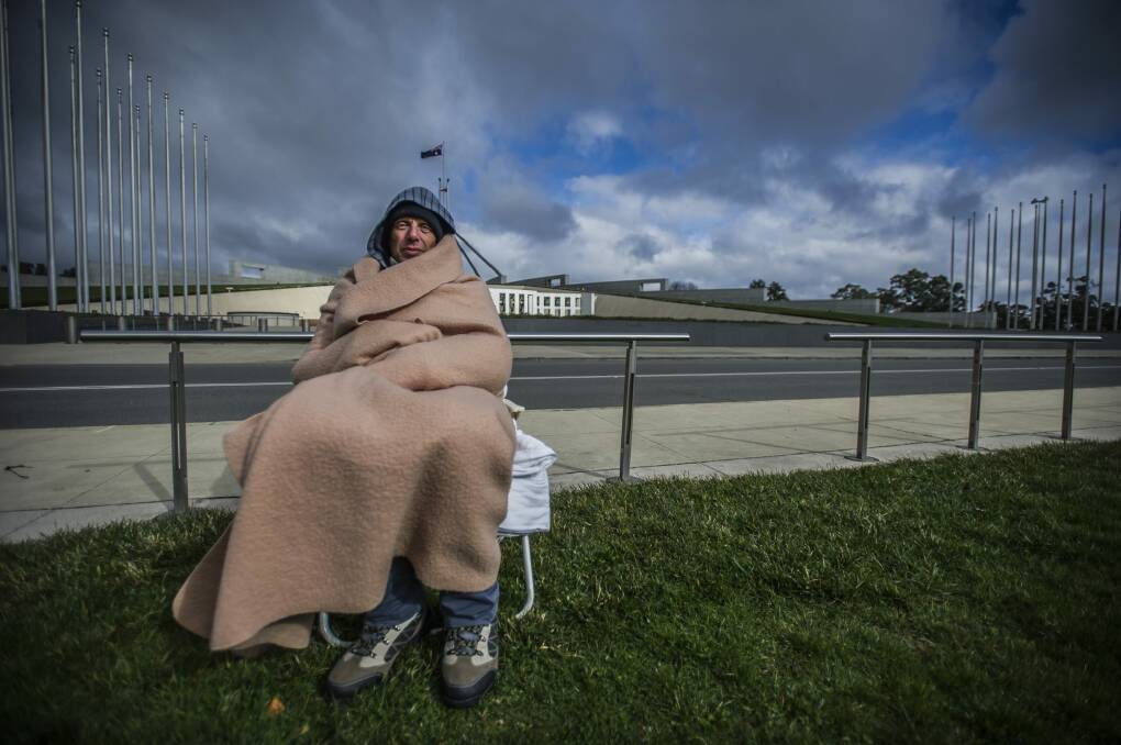 Hunger striker Alexander Miziner in Thursday's frigid conditions before the sprinklers were turned on. Photo: Karleen Minney
