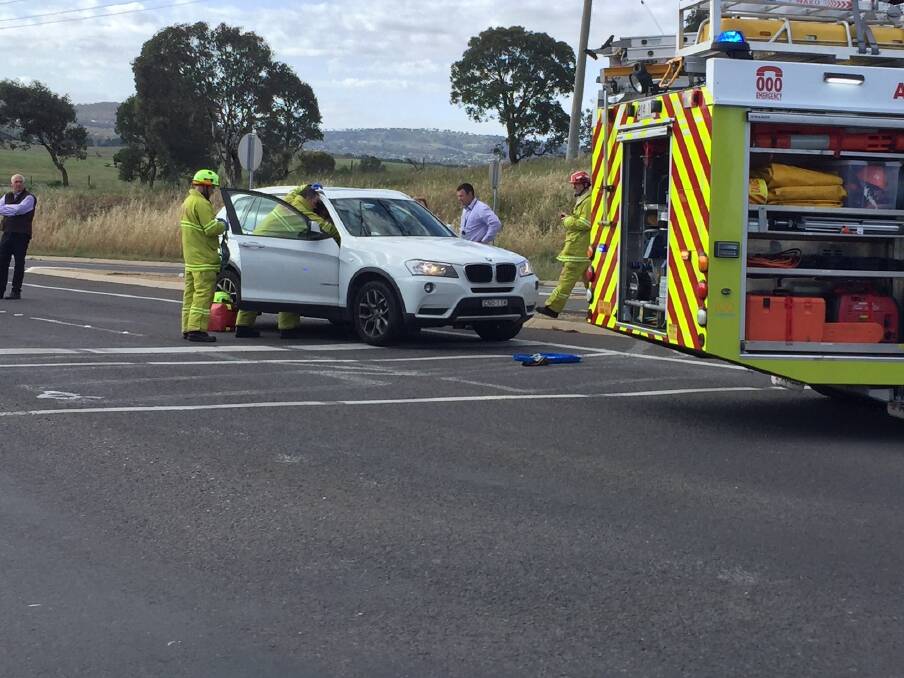 Firefighters on scene at a car crash at Fyshwick on Monday morning. Photo: Ron Aggs