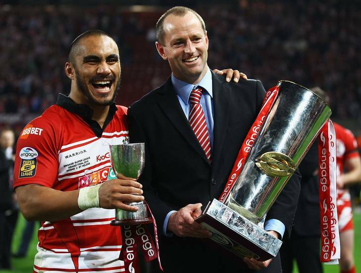 Maguire with Wigan Warriors half Thomas Leuluai after their 2010 Super League grand final win. Photo: Getty Images