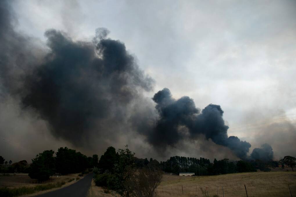 Thick smoke from the grass fire east of Queanbeyan on Friday afternoon. Photo: Jay Cronan