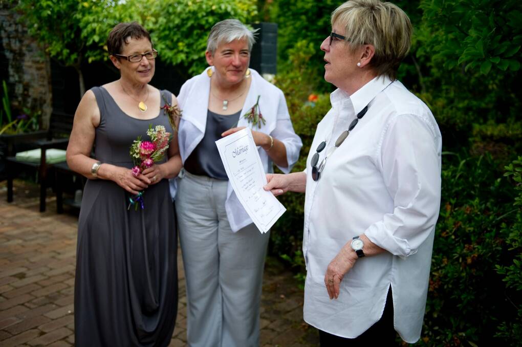 Anne-Marie Delahunt, centre, with her partner Margaret Penrose Clark and marriage celebrant Judy Aulich at their wedding in Canberra on December 9, 2013. The High Court later invalidated their marriage.  Photo: Jay Cronan