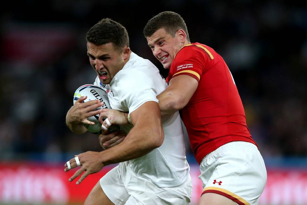 Sam Burgess is tackled by Scott Williams during the match between England and Wales. Photo: Getty Images