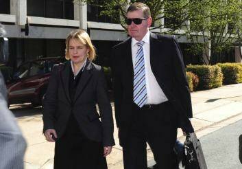 Peter Slipper arrives at the Magistrates Court with his lawyer, Kylie Weston-Scheuber. Photo: Melissa Adams