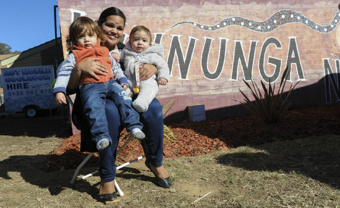Winnunga Nimmityjah Aboriginal Health Service will get four new clinical rooms and an expanded waiting area. Kristie Peters of Narrabundah with two of her children, Cameron Mutton, 2 and Adrian Mutton, 7 month, was at Wednesday's announcement.  Photo: Graham Tidy