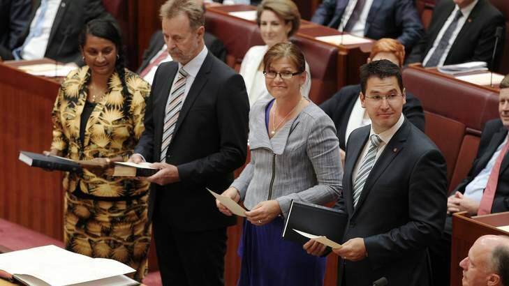 From left Nova Peris, Nigel Scullion, Kate Lundy and Zed Seselja are sworn-in as senators at Parliament House. Photo: Alex Ellinghausen
