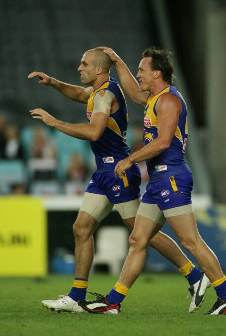 Daniel Chick and Chris Judd have different recollections of West Coast's tumultuous past. Photo: Vince Caligiuri