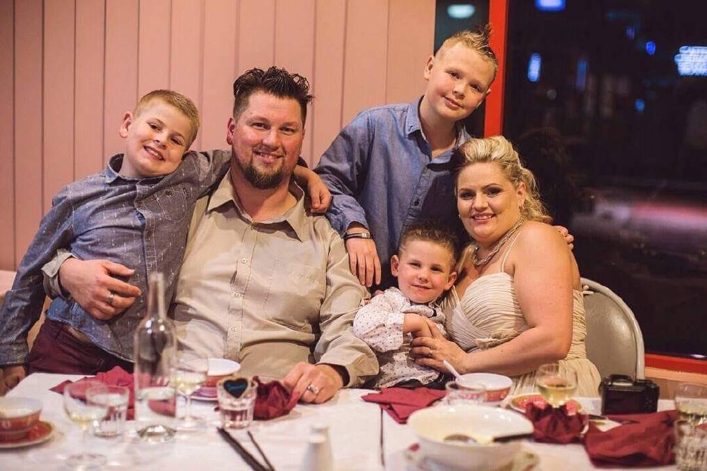 Macarthur couple James and Kylie Wiggins after their wedding, with her sons Ethan, 9; Kodi, 12; and Owen, four. Their extended family watched the ceremony as it was live streamed from the hospital to the Oriental Terrace restaurant in Erindale. Photo: Genevieve Dahl Photography