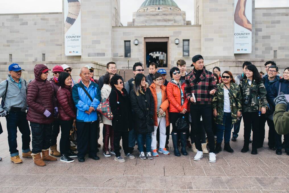 Some of the Singaporean tourists who are on a tour of Canberra and Sydney with Desmond Tan. Photo: Rohan Thomson
