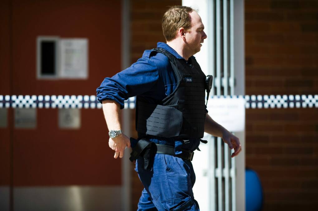 Scenes at the ANU after a man was arrested after allegedly attacking several people with a baseball bat in the Copland building, Room G032. Photo: Rohan Thomson