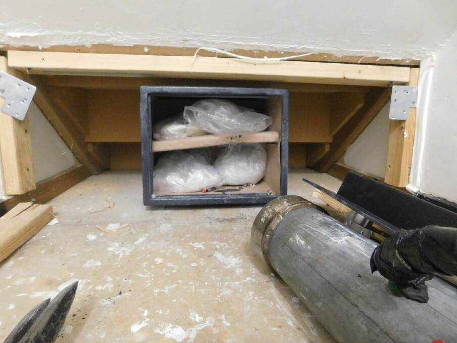 ACT police say they found ice and heroin with a combined street value of over $2 million in this safe hidden behind a false wall. Photo: Supplied