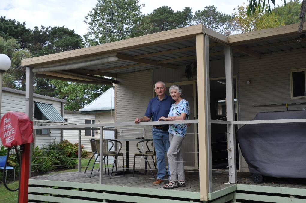 Canberra couple Elizabeth and Robin Turnbull outside their cabin, which they have been ordered to remove from Tomaga River Holiday Park by August 31. Photo: Kerrie O'Connor