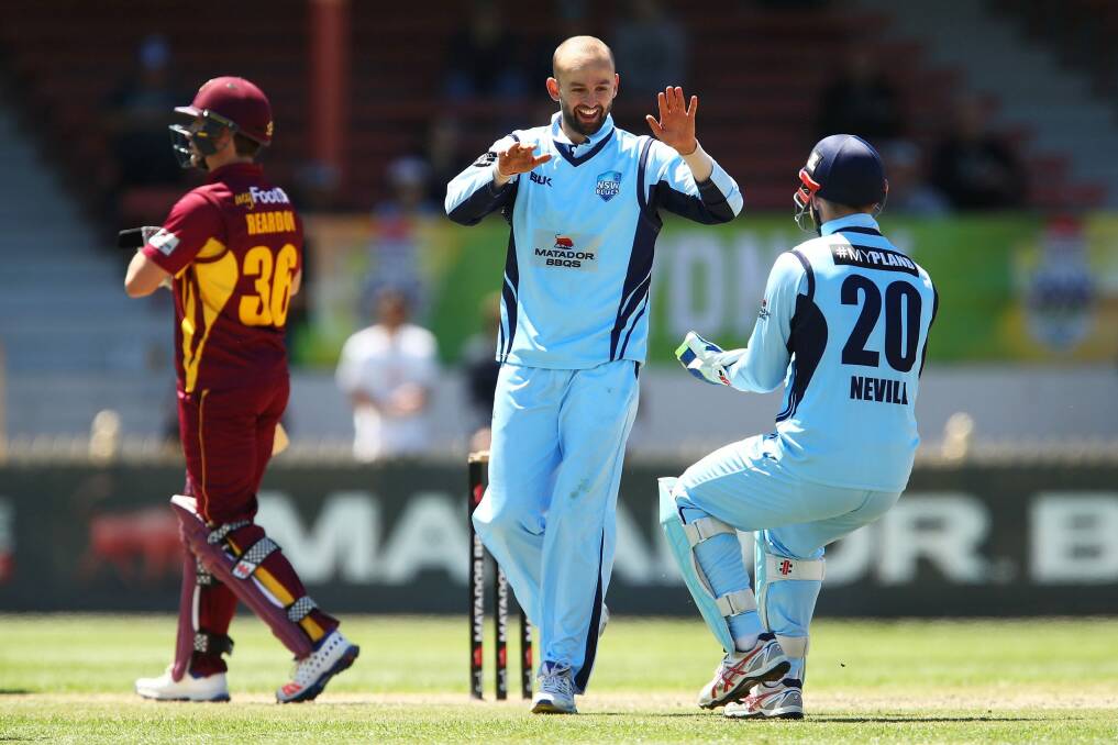 Another one: Nathan Lyon celebrates with Peter Nevill after claiming Ben Cutting's wicket. Photo: Getty Images